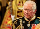 King Charles III gives recipients their honour or award in a special ceremony