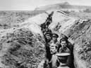 28th October 1914:  British soldiers lined up in a narrow trench during World War I.  (Photo by Hulton Archive/Getty Images)