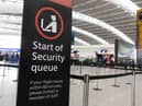 A sign indicating the start of the security queue during a strike by security workers at London Heathrow Airport in London, UK, on Friday, March 31, 2023. IAG SAsÂ British AirwaysÂ is set to scrap 320 flights during the Easter week as security workers strike for 10-days over pay. Photographer: Chris Ratcliffe/Bloomberg via Getty Images