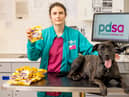 PDSA Veterinary Surgeon Team Leader Clare Sparks with Charlie and a kilo of Mini Eggs at PDSA in Bournemouth