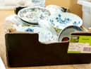 The cardboard box containing a collection of dishes including Chinese ceramics which sold for a total of £112,000.  