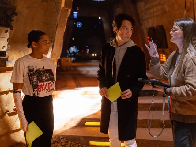 Amandla Stenberg, Lee Jung-jae, and director Leslye Headland on the set of The Acolyte (Credit: Christian Black / Lucasfilm)