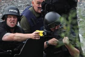 JULY 09:  Police negotiate with a man fitting the description of fugitive gunman Raoul Moat on July 9, 2010 in Rothbury, England.