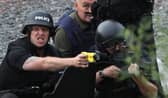 JULY 09:  Police negotiate with a man fitting the description of fugitive gunman Raoul Moat on July 9, 2010 in Rothbury, England.