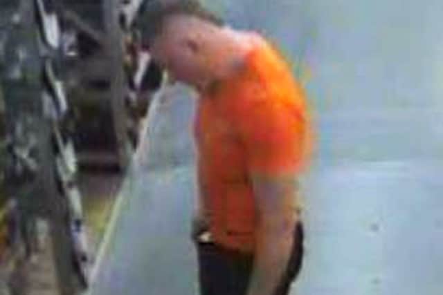JULY 2:  In this handout image released by the Northumbrian Police, A CCTV image shows  fugitive 37 years old Raoul Moat in a Newcastle shop on Friday, July 2 revealing he was wearing an orange t-shirt, dark coloured jeans and white trainers on July 2, 2010 in Newcastle-Upon-Tyne, 