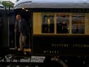 A man disembarks from the Venice Simplon-Orient-Express after arriving at Istanbul Station in Istanbul (Photo by YASIN AKGUL/AFP via Getty Images)