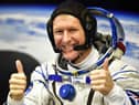 Britain's astronaut Tim Peake gestures as his space suit is tested at the Russian-leased Baikonur cosmodrome (photo: Getty Images)