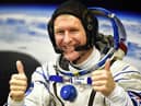 Britain's astronaut Tim Peake gestures as his space suit is tested at the Russian-leased Baikonur cosmodrome (photo: Getty Images)