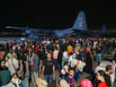 People evacuated from Sudan arrive at a military airport in Amman on 24 April 2023 (Photo: KHALIL MAZRAAWI/AFP via Getty Images)