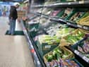 A shopper browses for fruit and vegetables in a Tesco supermarket in London on December 14, 2020 (Getty Images)