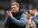 Newcastle United head coach Eddie Howe applauds fans.