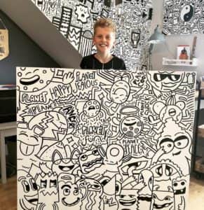 Joe Whale, aka The Doodle Boy, with one of his artworks