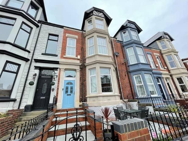 This terraced property features a small front garden area that has space for a table and chairs