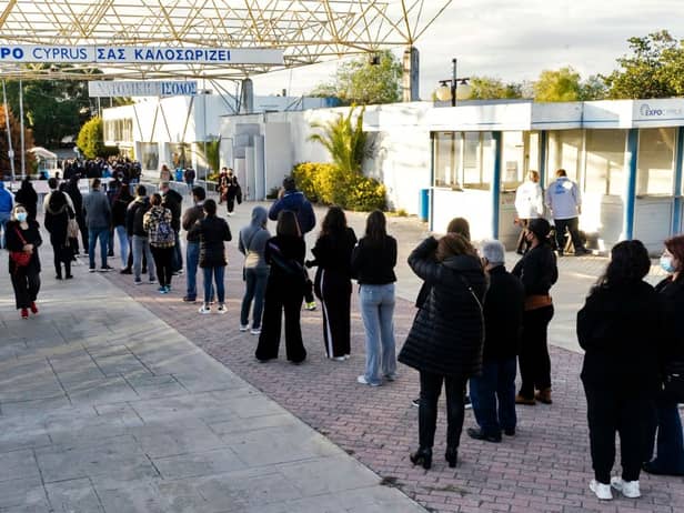Cypriots wait in line to receive the third dose of a Covid-19 vaccine at a walk-in vaccination centre (Photo: Getty Images)