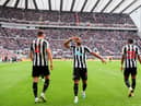 Callum Wilson of Newcastle United (C) celebrates after scoring the team's first goal during the Premier League match between Newcastle United and Southampton FC at St. James Park on April 30, 2023 in Newcastle upon Tyne, England. (Photo by Stu Forster/Getty Images)
