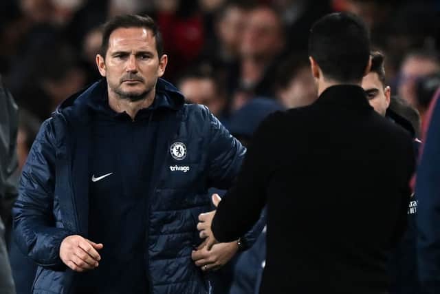 Chelsea’s English caretaker manager Frank Lampard (L) congratulates Arsenal’s Spanish manager Mikel Arteta (Photo by BEN STANSALL/AFP via Getty Images)