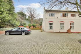 The front of the property has a large driveway for lots of cars