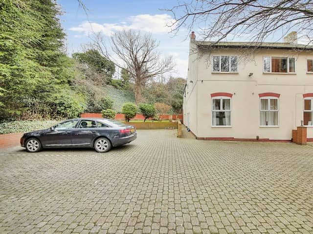 The front of the property has a large driveway for lots of cars