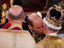  Prince William kisses his father, Britain’s King Charles III as he pays homage (Photo: Getty Images)
