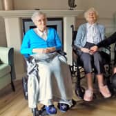 Peggy, 100 and Marjorie, 102 with Sycamore Care Centre manager, Amy.