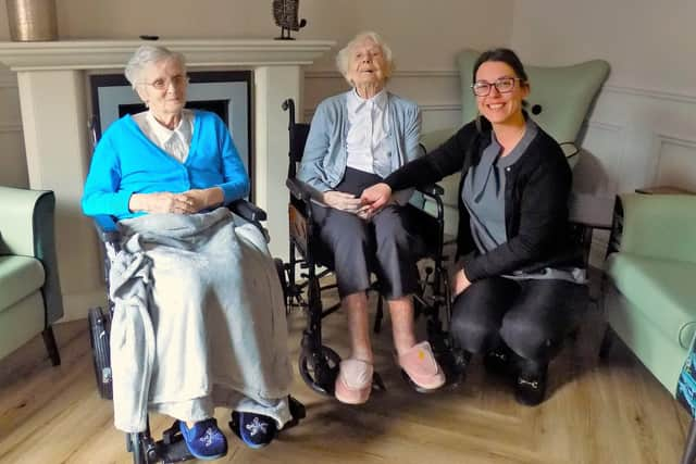 Peggy, 100 and Marjorie, 102 with Sycamore Care Centre manager, Amy.