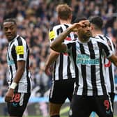 Newcastle striker Callum Wilson celebrates with team mates after scoring the  6th goal during the Premier League match between Newcastle United and Tottenham Hotspur at St. James Park on April 23, 2023 in Newcastle upon Tyne, England.