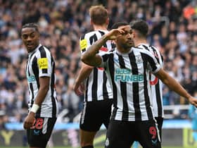 Newcastle striker Callum Wilson celebrates with team mates after scoring the  6th goal during the Premier League match between Newcastle United and Tottenham Hotspur at St. James Park on April 23, 2023 in Newcastle upon Tyne, England.