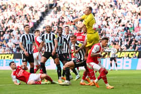 Aaron Ramsdale of Arsenal attempts to make save during the Premier League match between Newcastle United and Arsenal FC at St. James Park on May 07, 2023 in Newcastle upon Tyne, England. 