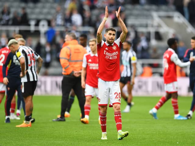 Jorginho applauds Arsenal fans at St James' Park.