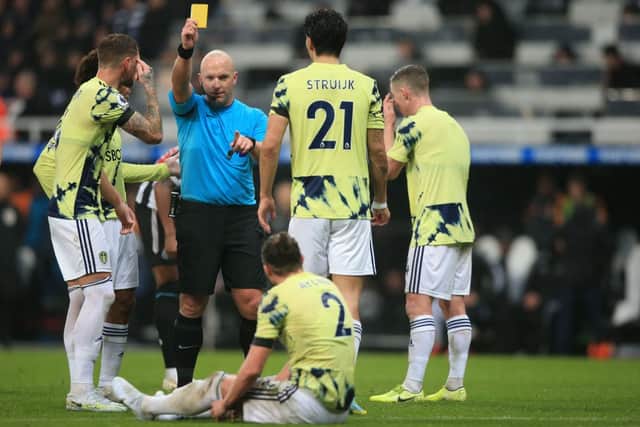 Simon Hooper hands out a yellow card in Newcastle United v Leeds United. 