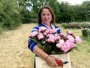 Elonor Tivey at her seven acre field in Leicestershire where she farms peonies. 