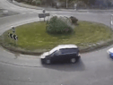 The moment a driver put their Need for Speed to the test as they drift around a busy roundabout.