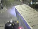 The car is seen smashing into the lorry.