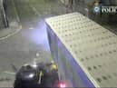 The car is seen smashing into the lorry.