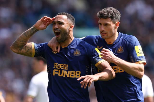 Newcastle United No.9 Callum Wilson celebrates his goal with Fabian Schar.