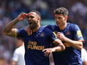 Newcastle United No.9 Callum Wilson celebrates his goal with Fabian Schar.