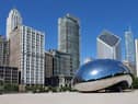 The Cloud Gate sculpture, popularly known as the bean, with Chicago's skyline