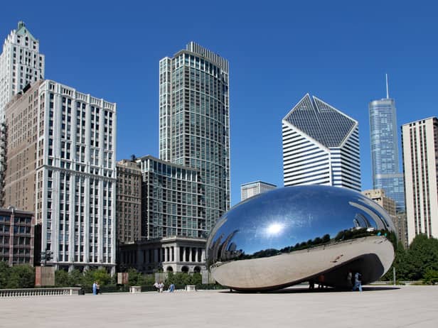 The Cloud Gate sculpture, popularly known as the bean, with Chicago's skyline