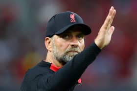 Liverpool manager Jurgen Klopp waves to fans after a match