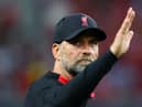 Liverpool manager Jurgen Klopp waves to fans after a match