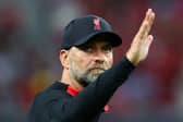 Liverpool manager Jurgen Klopp waves to fans after a match