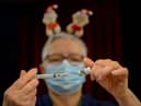 Pfizer BioNTech vaccines are prepared at Army Reserve Centre on December 23, 2021 in Poole, England.  (Photo: Getty)