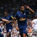 Callum Wilson of Newcastle celebraters with Miguel Almiron after scoring the second Newcastle goal from the penalty spot during the Premier League match between Leeds United and Newcastle United at Elland Road on May 13, 2023 in Leeds, England. (Photo by Stu Forster/Getty Images)