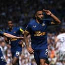 Callum Wilson of Newcastle celebraters with Miguel Almiron after scoring the second Newcastle goal from the penalty spot during the Premier League match between Leeds United and Newcastle United at Elland Road on May 13, 2023 in Leeds, England. (Photo by Stu Forster/Getty Images)