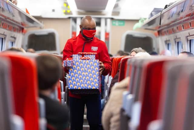 Titani Kamphandira, LNER Customer Experience Host, returns professionally wrapped presents to launch the rail operators complimentary Rail Wrapping service (photo: David Parry/PA Wire)