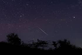 A meteor streaking through the night sky over Myanmar during the Geminid meteor shower in 2018 (Photo: YE AUNG THU/AFP via Getty Images)