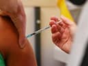 A member of the public receives a dose of the Pfizer BioNtech vaccine at a vaccination centre (Getty Images)