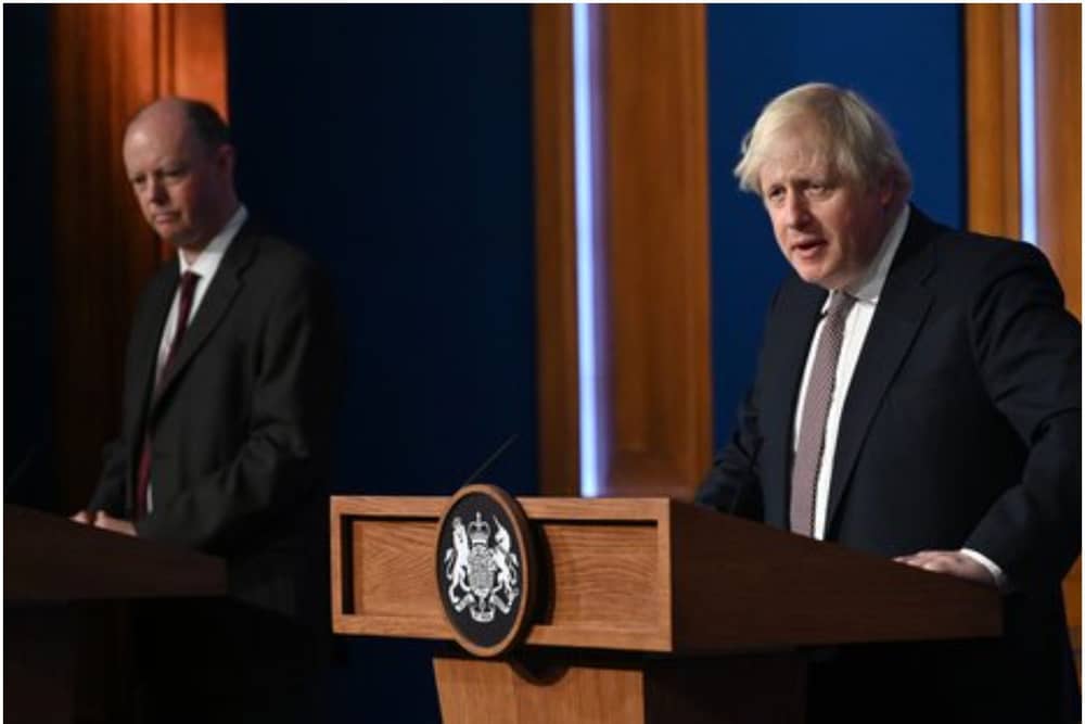 LONDON, ENGLAND - NOVEMBER 15: Prime Minister Boris Johnson standing next to British Chief Medical Officer for England Chris Whitty as he addresses the media regarding the United Kingdom's Covid-19 infection rate and vaccination campaign at Downing Street Briefing Room on November 15, 2021 in London, England. The prime minister and his advisers encouraged Britons to receive their Covid-19 vaccine booster when eligible. (Photo by Leon Neal - WPA Pool/Getty Images)
