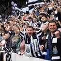 Newcastle United's supporters cheer during the English Premier League football match between Newcastle United and Brighton and Hove Albion at St James' Park in Newcastle-upon-Tyne, north east England on May 18, 2023. (Photo  (Photo by OLI SCARFF/AFP via Getty Images)