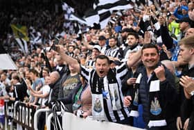 Newcastle United's supporters cheer during the English Premier League football match between Newcastle United and Brighton and Hove Albion at St James' Park in Newcastle-upon-Tyne, north east England on May 18, 2023. (Photo  (Photo by OLI SCARFF/AFP via Getty Images)